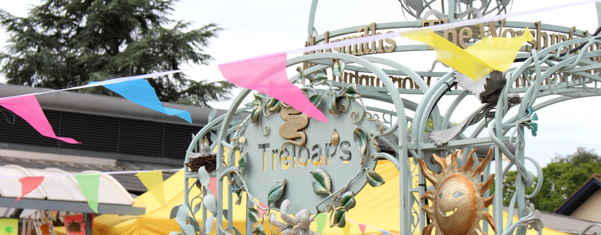 Treloar's archway and a colourful bunting across of it.