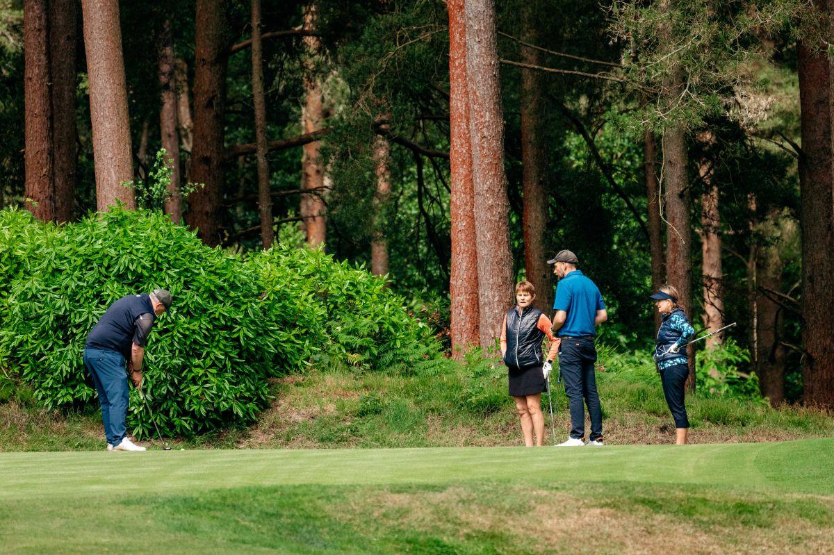 Golf team playing golf at The Old Thorns Hotel & Resort