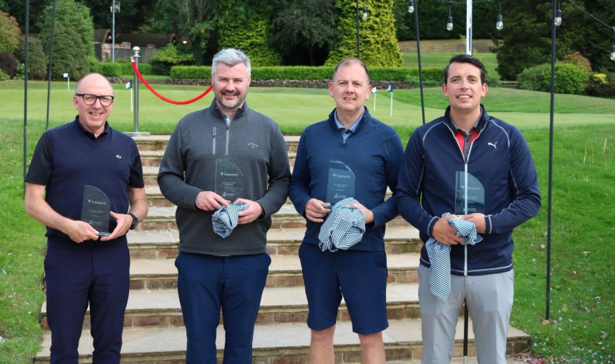 Four golfers pose for a team photo at Treloar's Charity Golf Day