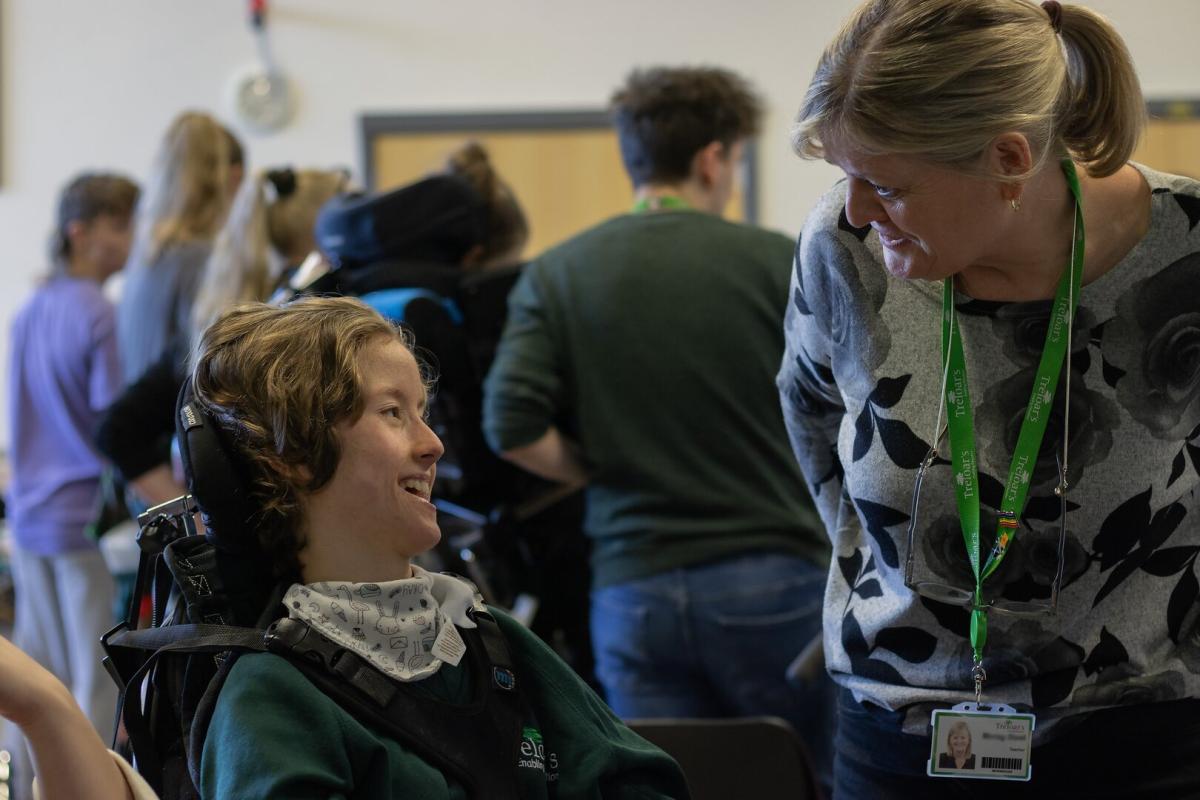 Treloar School student with a teacher, speaking together