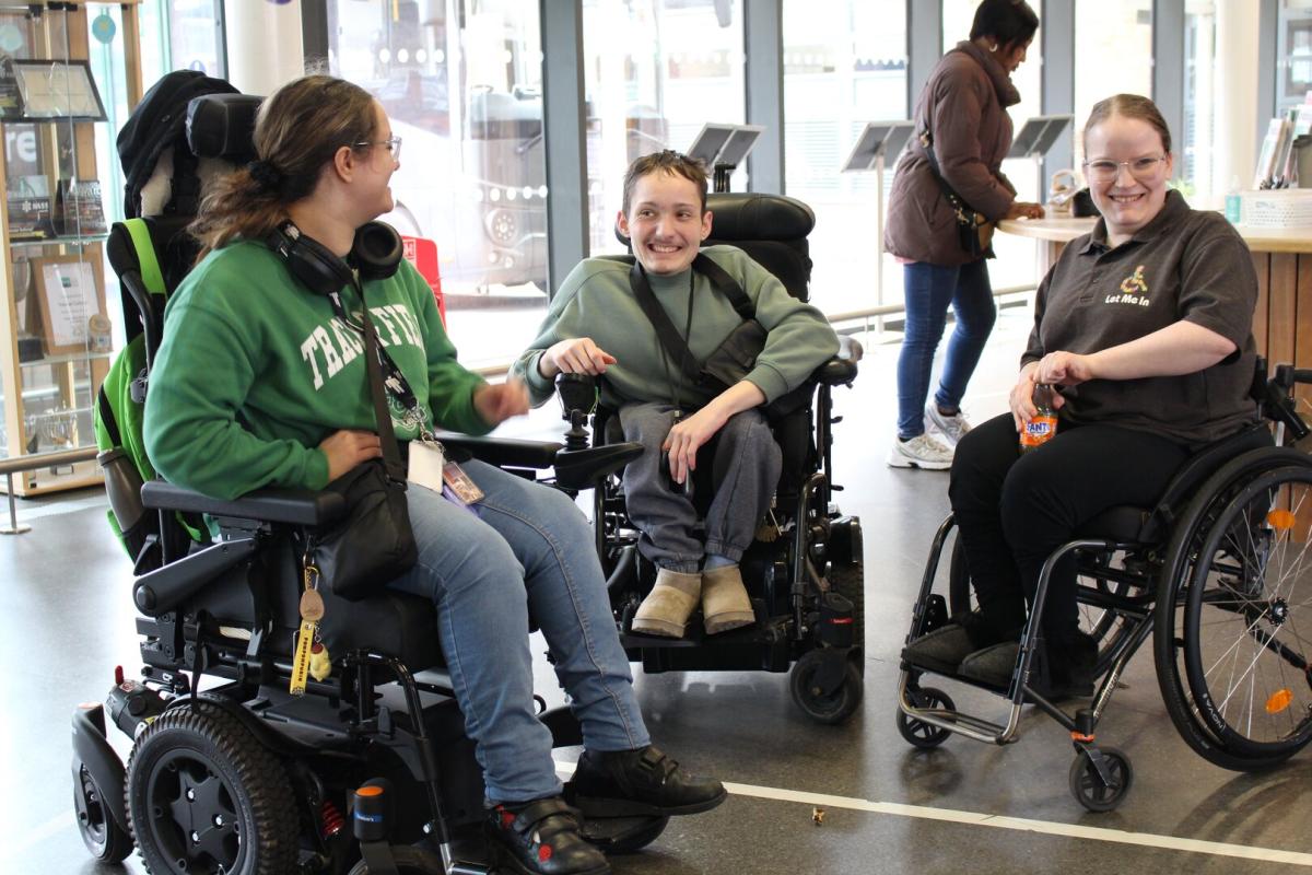 A group of three Treloar College students in the reception area