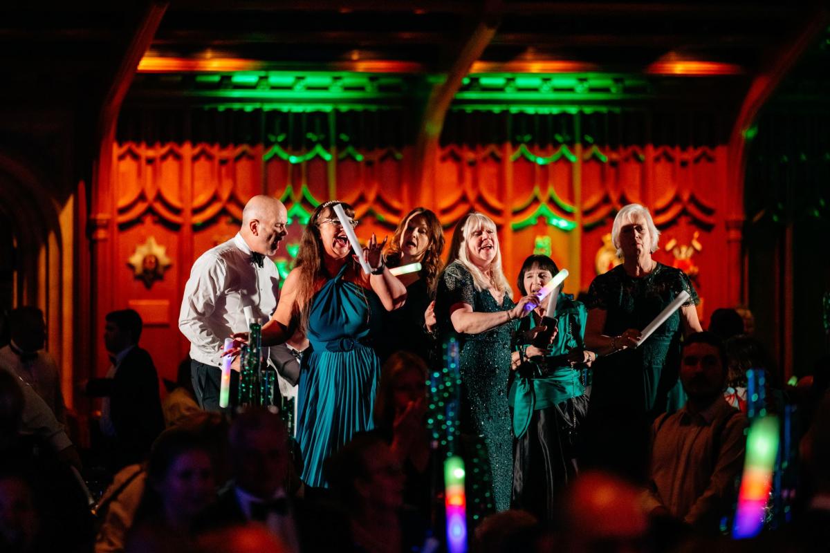 Guests dancing with glow sticks
