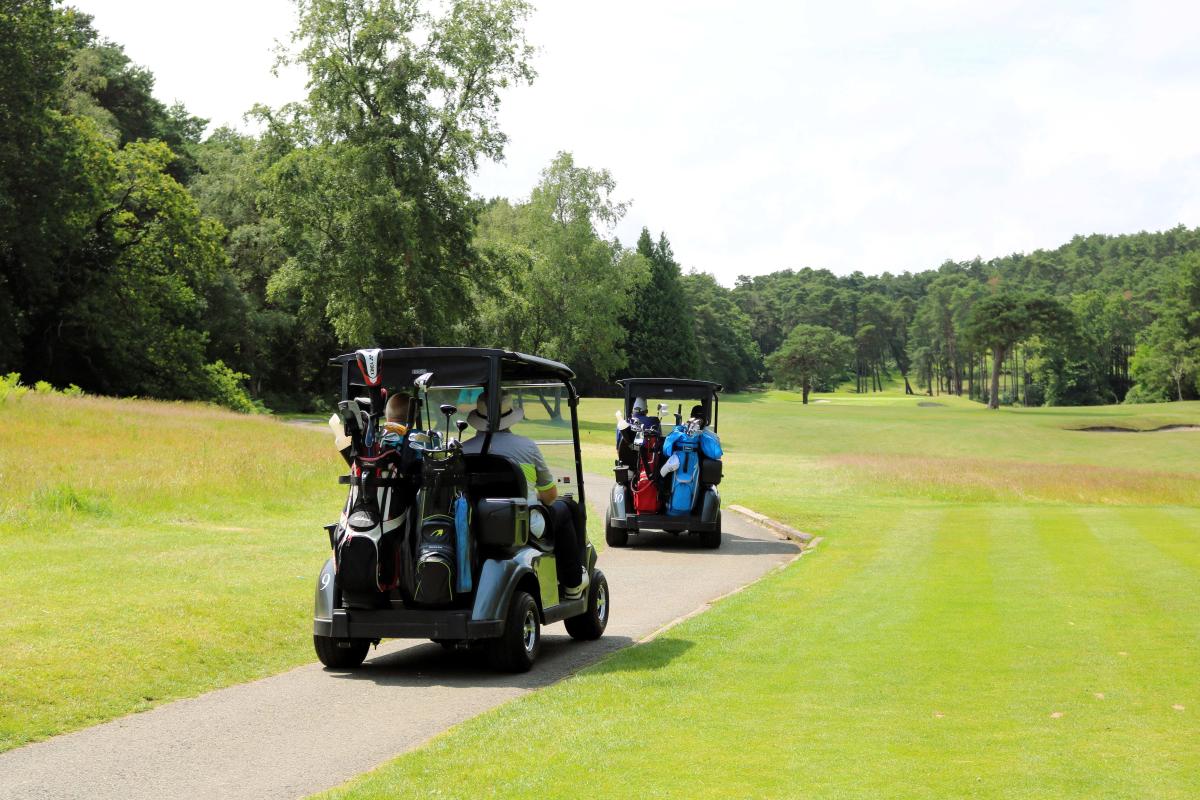 Golf buggies driving around course