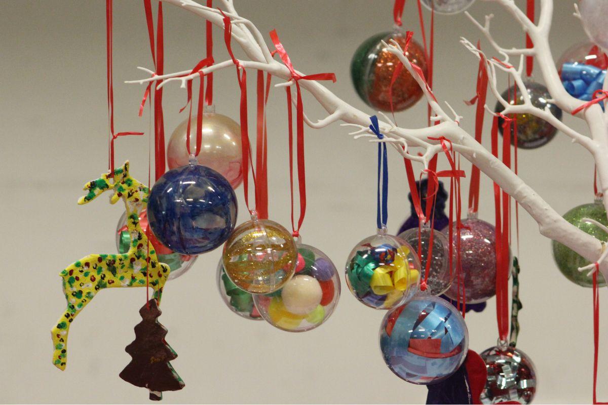 Handmade and decorated bulbuls hanging from a branch