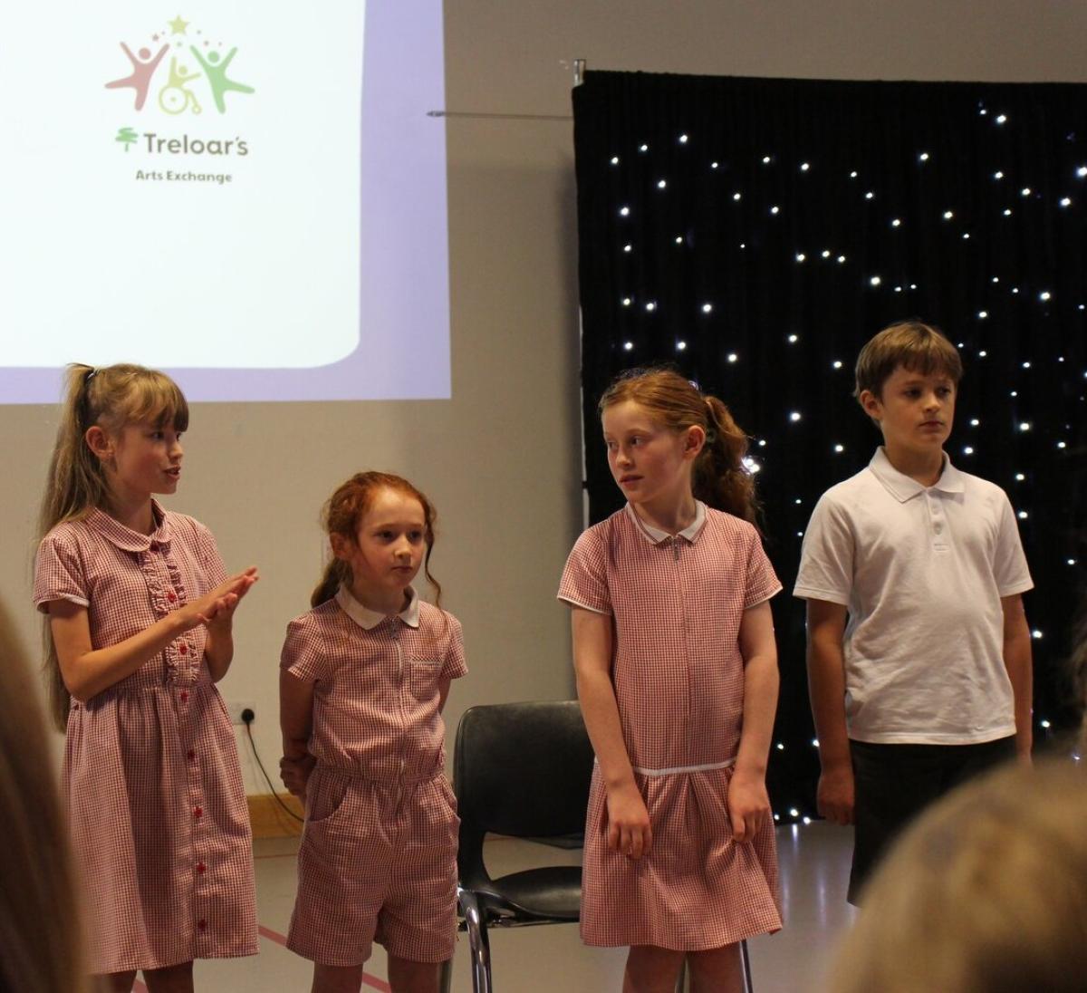 Students performing poetry at Treloar's Art Exchange