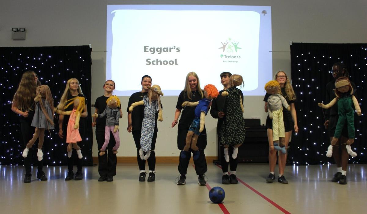 Students with puppets perform at Treloar's Art Exchange