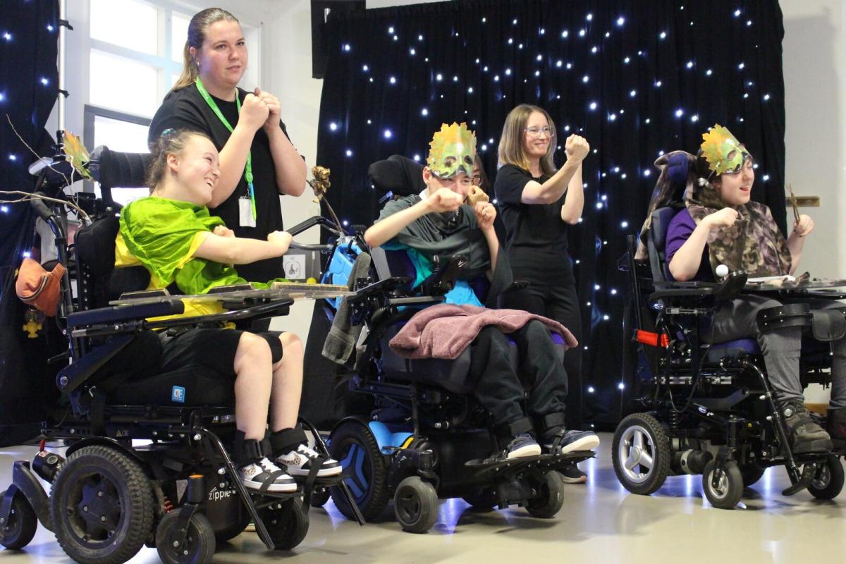 Students in wheelchairs performing in Treloar's Art Exchange