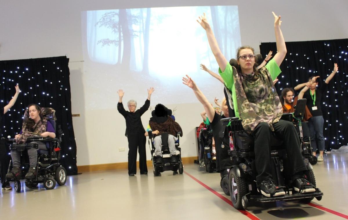 Students in wheelchairs performing a dance together at Treloar's Art Exchange