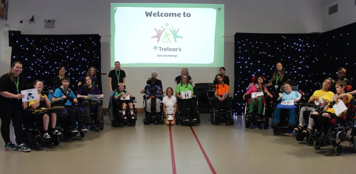 A group of students in wheelchairs, seated in a semi circle, at Treloar's Art Exchange June 2026