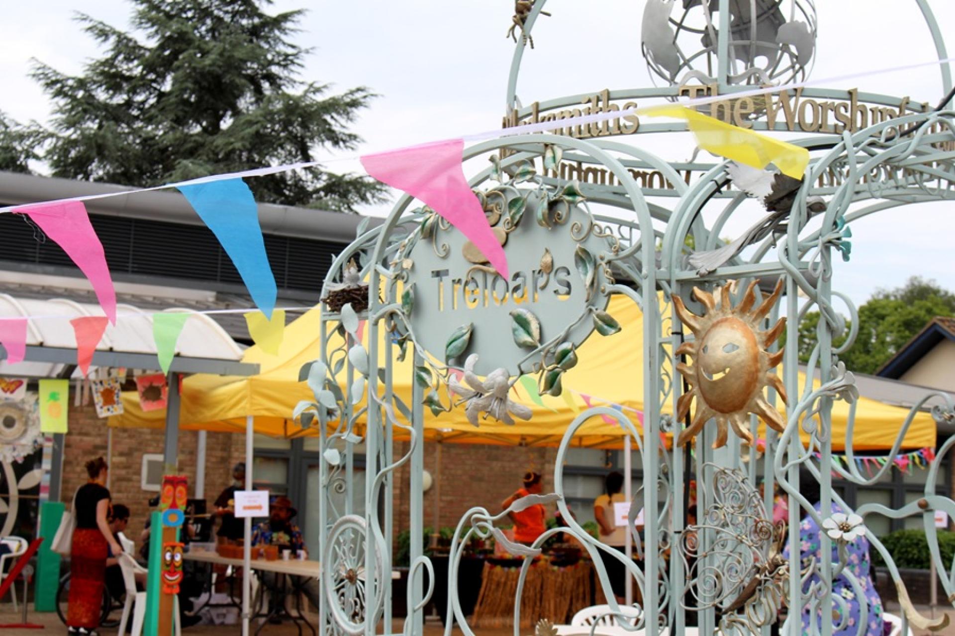 Treloar's archway and a colourful bunting across of it.