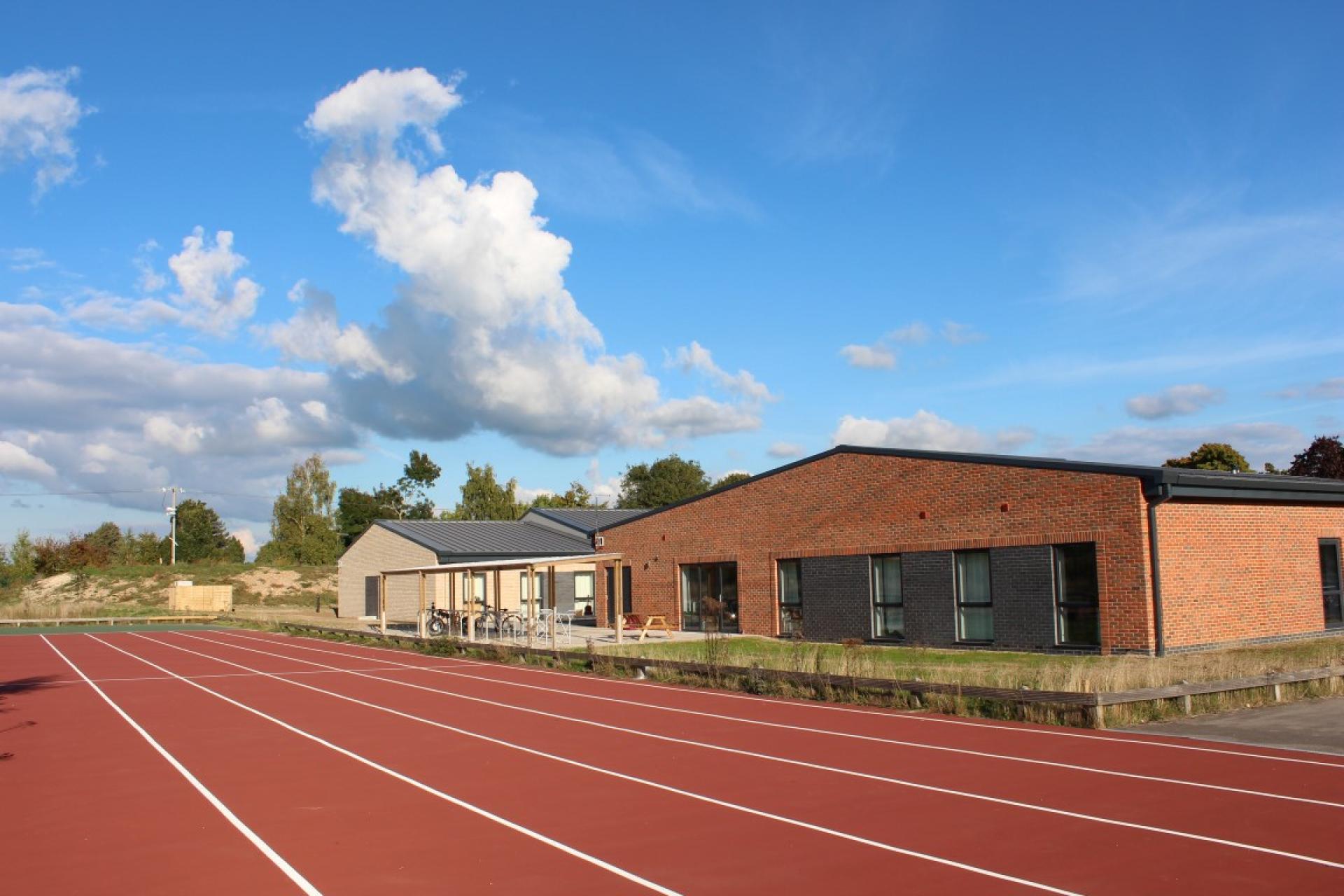 Hope Court, Treloar's Key worker accommodation seen from across the Sports track