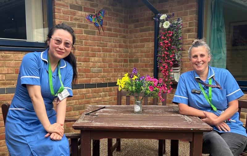 Treloar's nurses Sara and Fiona sit outside one of the residential houses