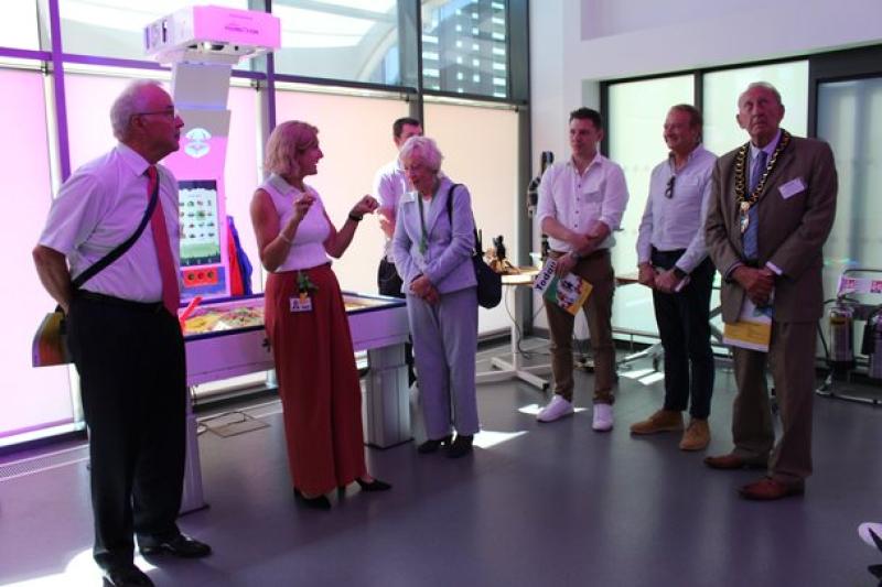 Donors at the official opening of the new Bradbury Learning Centre; also gather in the semi circle listening to a talk.