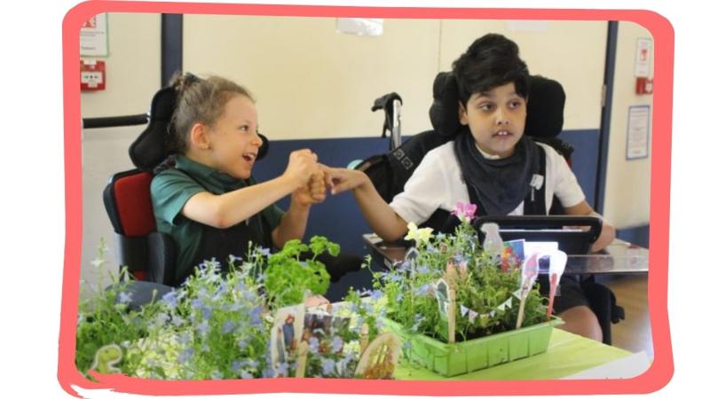 Treloar school students holding hands with their mini gardens