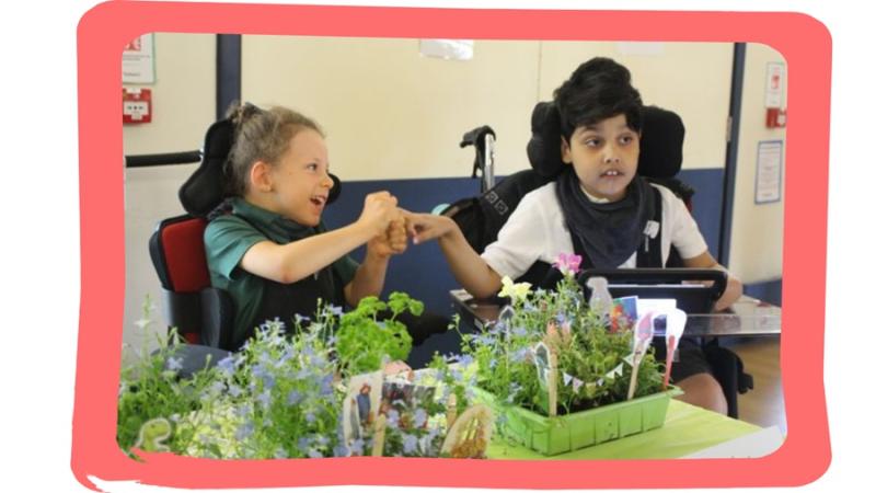 Treloar school students holding hands with their mini gardens