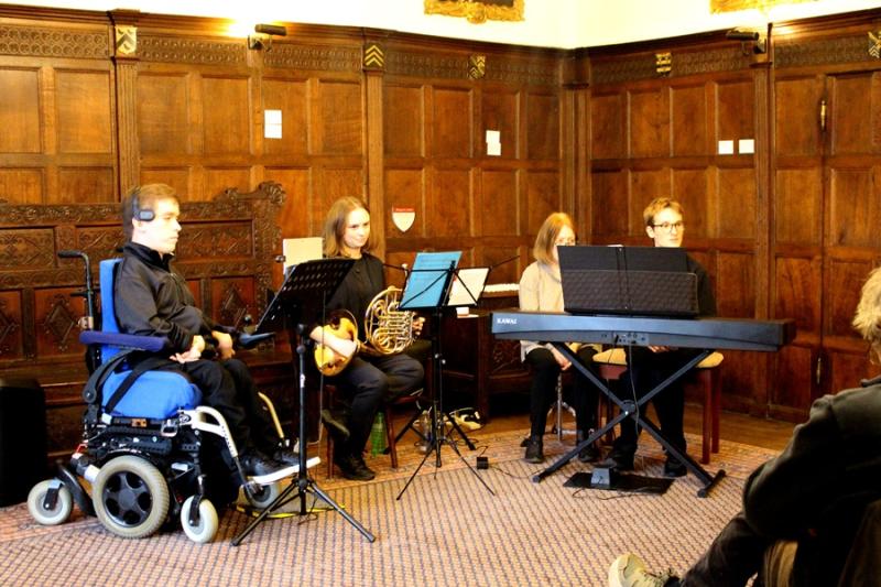 Treloar's former student Alessandro Vazzana performed with the Clarion Trio—Oscar Abbott on piano, Georgina Spray on French horn, and Alessandro on Clarion in a room in the Chawton House.