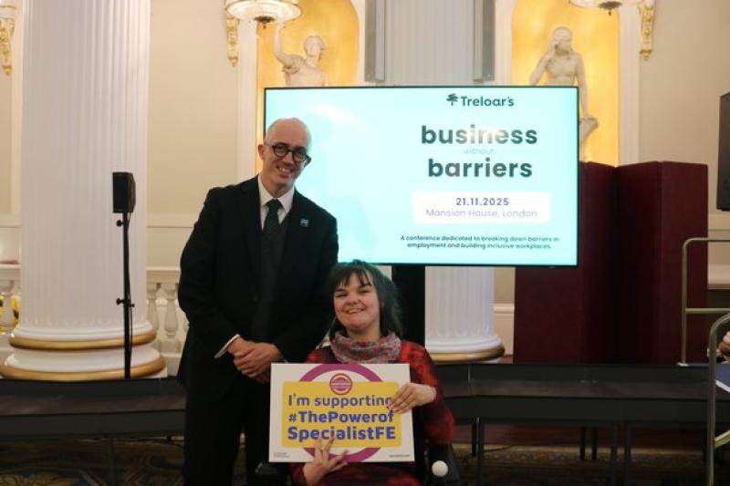 Head of College Ben Bastin attending Business without Barriers event at Mansion House with student, holding a banner which reads 'I'm supporting The Power of Specialist FE'