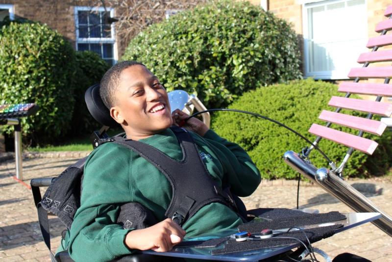 School student playing a musical instrument in the piazza