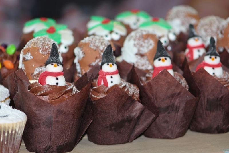 Chocolate cupcakes with snowmen sweeties on
