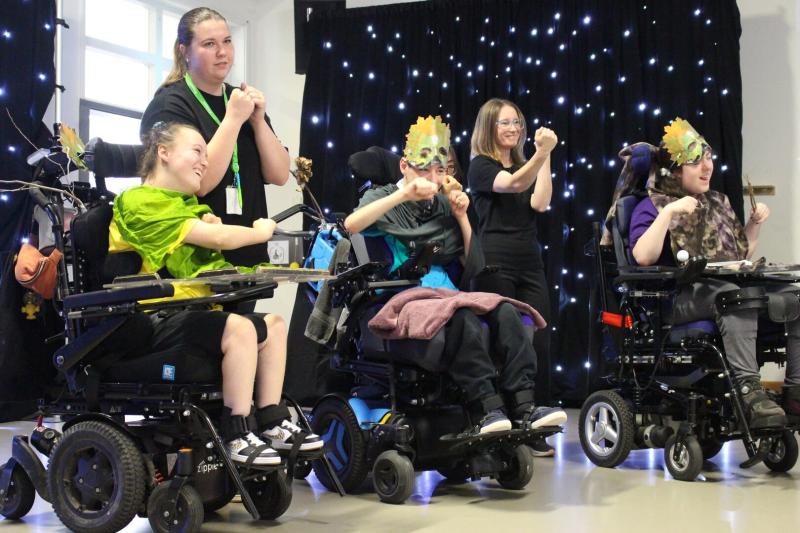 Students in wheelchairs performing in Treloar's Art Exchange