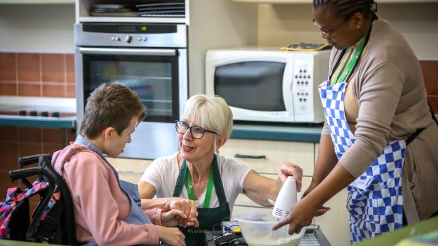 Student in kitchen preparing to make a cake