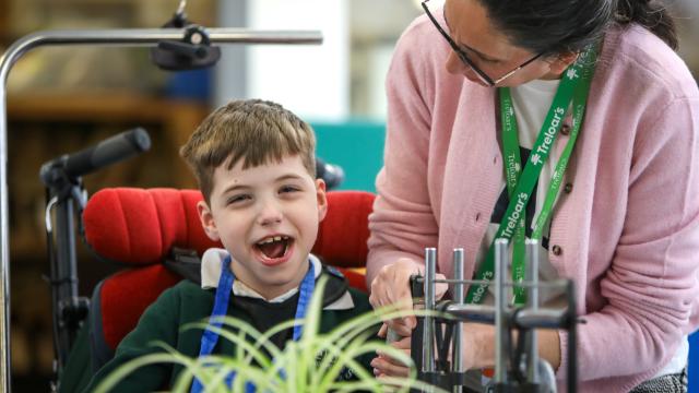 Boy with teacher in a classroom