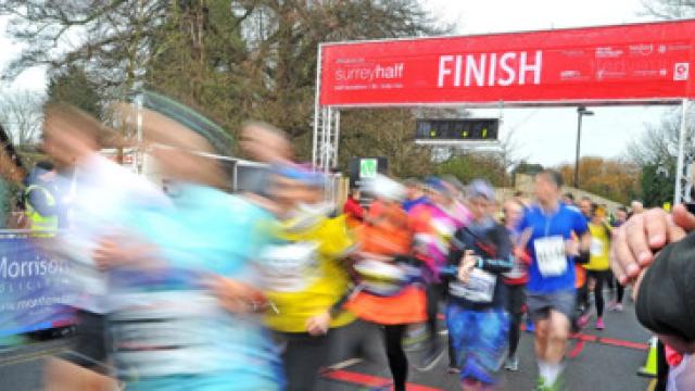 Runners crossing the finish line at an active event