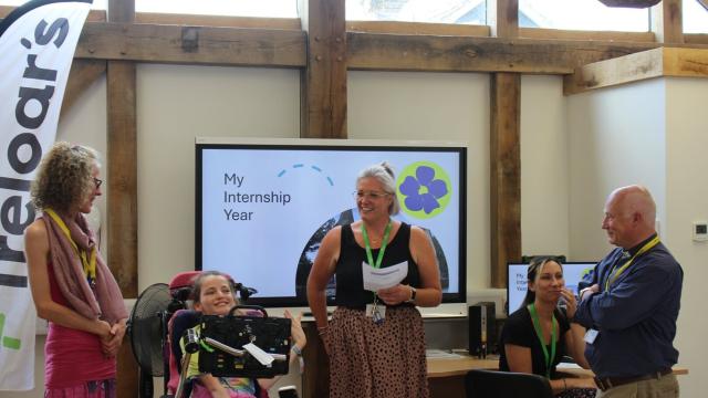 Treloar's Supported Internship lead, Hazel, giving a presentation with a student about their internship year