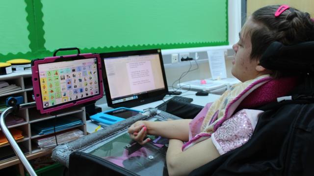Treloar's student using her AAC device during her lesson.