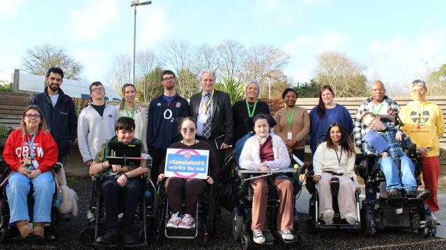 Damian Hinds, MP for East Hampshire with a group of Treloar College students, one is holding a pledge board which says 'Specialist FE works for me'