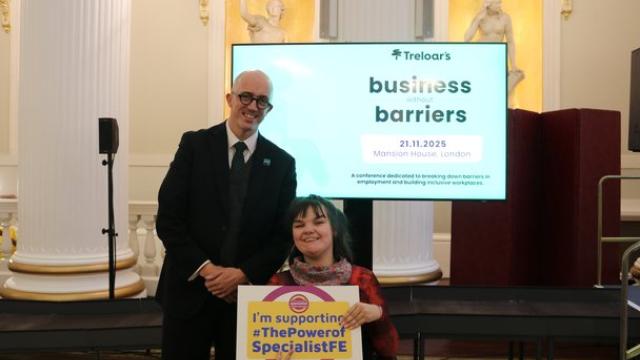 Head of College Ben Bastin attending Business without Barriers event at Mansion House with student, holding a banner which reads 'I'm supporting The Power of Specialist FE'