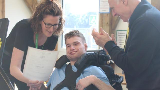 Lisa Bond Head of School giving a Duke of Edinburgh award certificate to a student