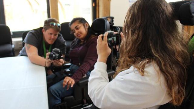 Students using cameras during a photography workshop
