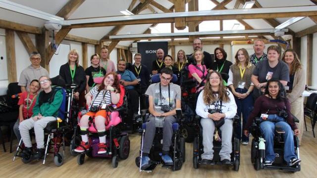 A group of College students in wheelchairs with cameras attending a Sony photography workshop