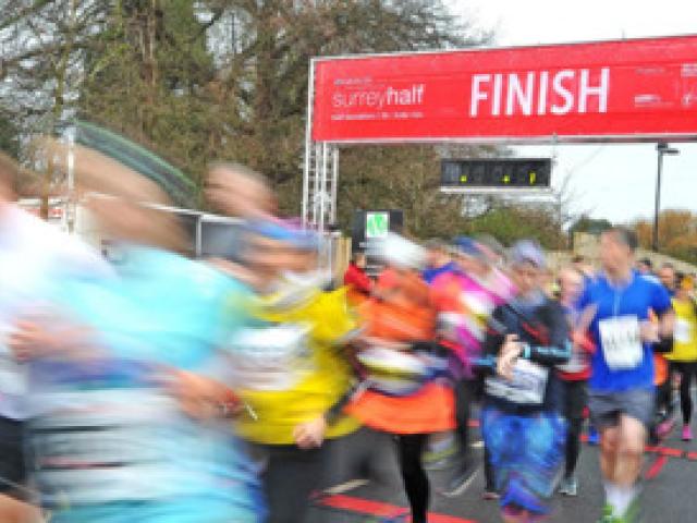 Runners crossing the finish line at an active event