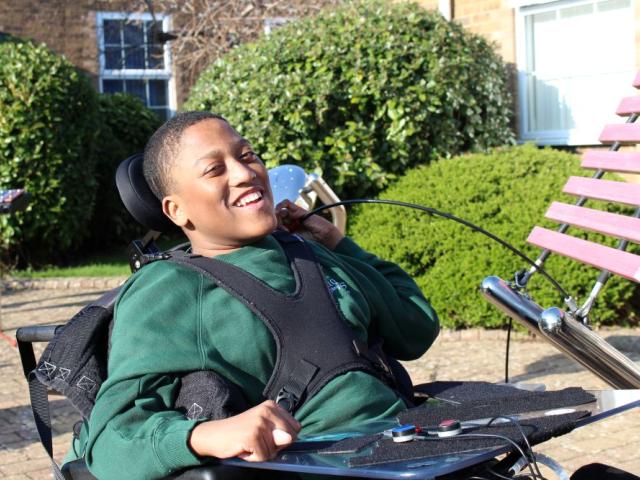 School student playing a musical instrument in the piazza