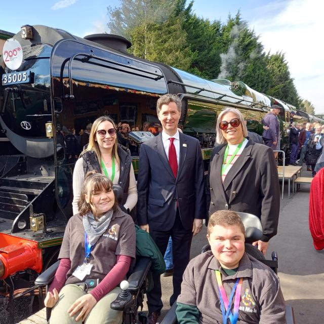 The Canadian High Commissioner with Treloar College students, stand in front of the Canadian Pacific locomotive at the launch on The Watercress Line