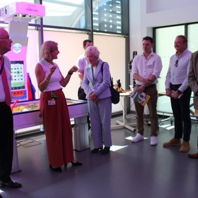 Donors at the official opening of the new Bradbury Learning Centre; also gather in the semi circle listening to a talk.