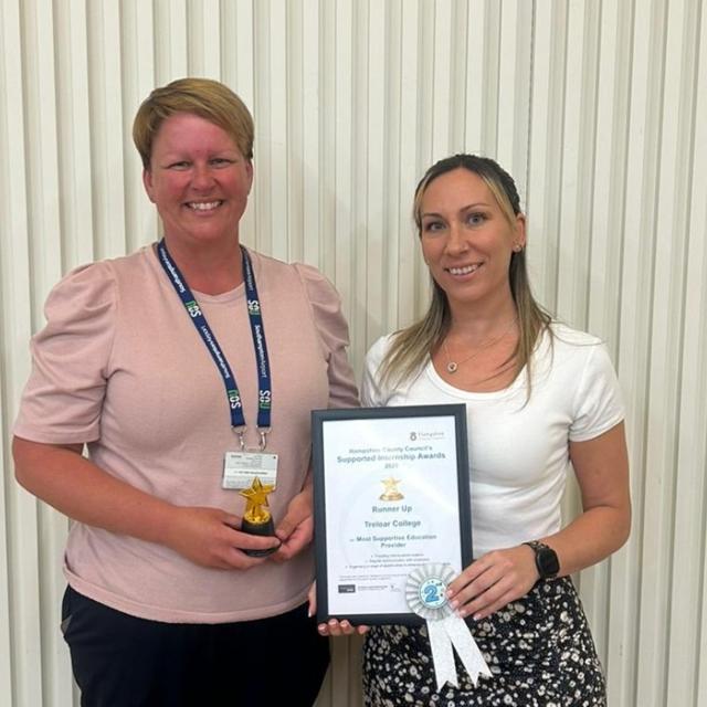 Holly Larvan, Treloar's Supported Internship Technician and Gemma Foreman from Southampton Airport posing for a photo with an award and a certificate.