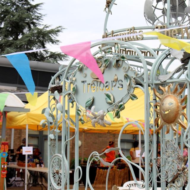 Treloar's archway and a colourful bunting across of it.