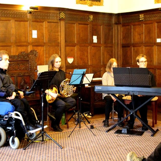Treloar's former student Alessandro Vazzana performed with the Clarion Trio—Oscar Abbott on piano, Georgina Spray on French horn, and Alessandro on Clarion in a room in the Chawton House.