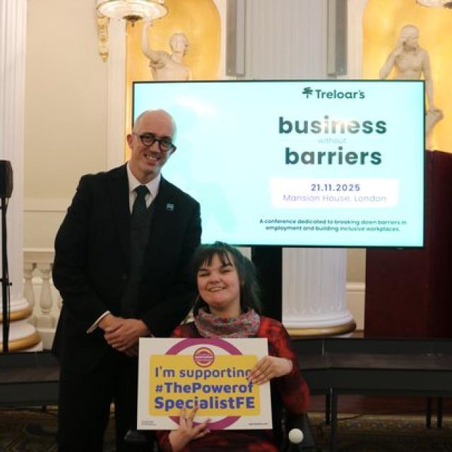 Head of College Ben Bastin attending Business without Barriers event at Mansion House with student, holding a banner which reads 'I'm supporting The Power of Specialist FE'
