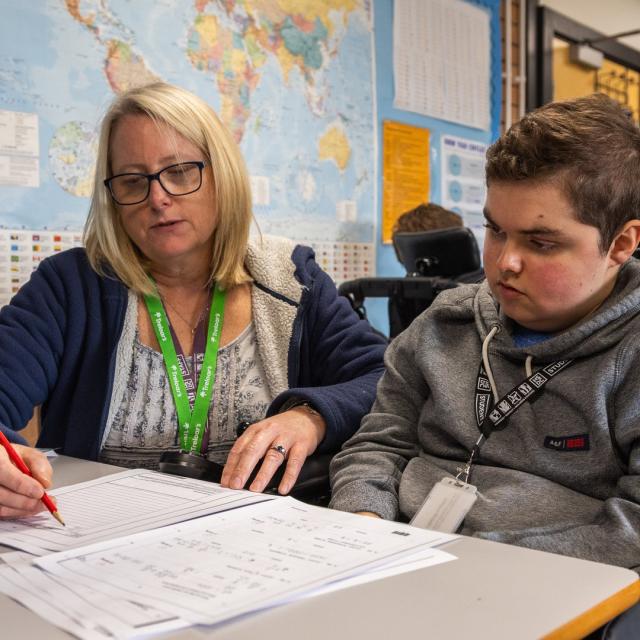 Treloar College student working at HSDC Alton College with support assistant alongside