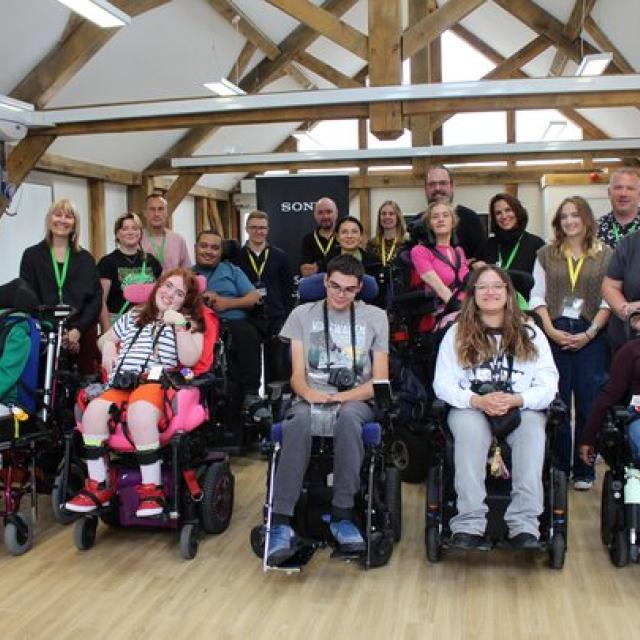 A group of College students in wheelchairs with cameras attending a Sony photography workshop