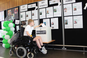 student casting a vote