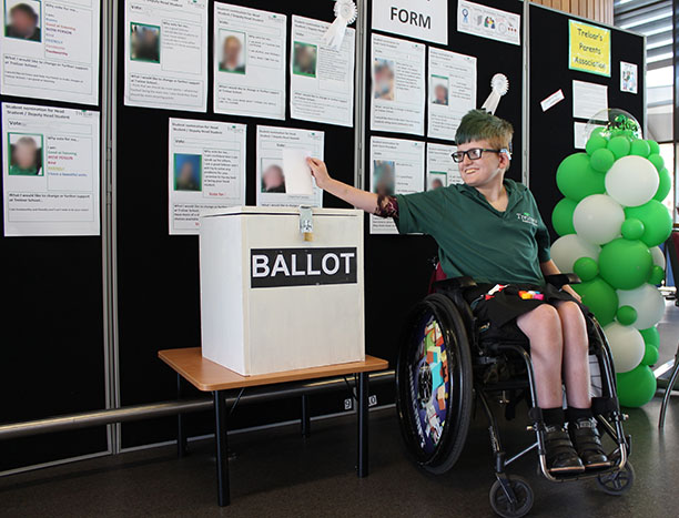 Student casting a vote
