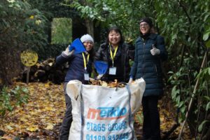 Corporate supporters clearing Forest School