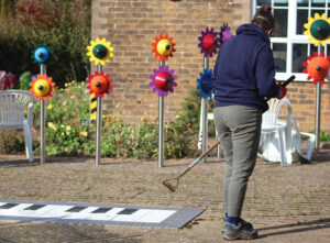 Corporate volunteer tidying up the piazza