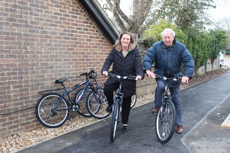 New bikes for Treloar's staff: Alton Town Councillor for Holybourne, Graham Hill with Lucinda Gillingham, Treloar's Director of Fundraising and Marketing, posing on bikes