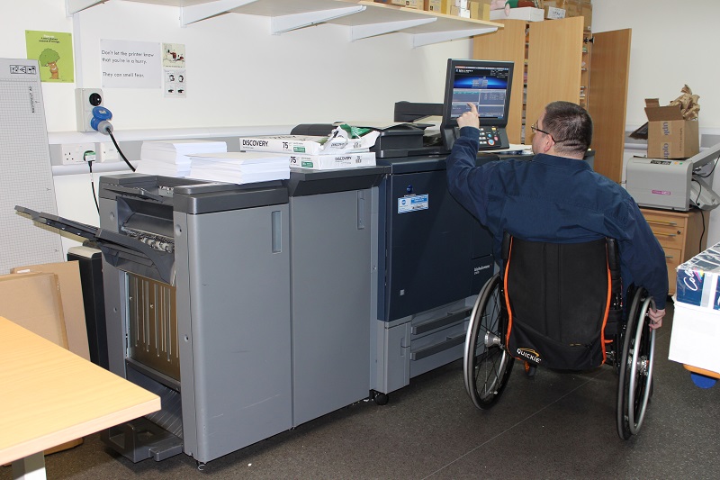 TreloarPrint: Aaron working: operating a printer